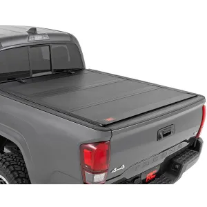 Rough Country Hard Tri-Fold Flip Up Bed Cover | 2016-2023 Toyota Tacoma